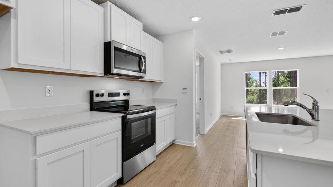 Representative furnished interior of a home built from the Aria+ by D.R. Horton in The Arbors, Jacksonville (Image 5).