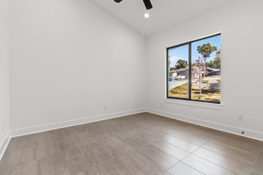 Spare room featuring lofted ceiling, ceiling fan, and recessed lighting