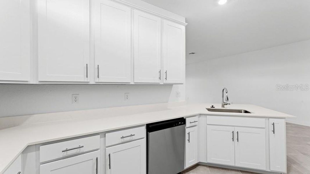 Furnished interior view inside a new home in Palm Lake at Coco Bay, Englewood (Image 11).