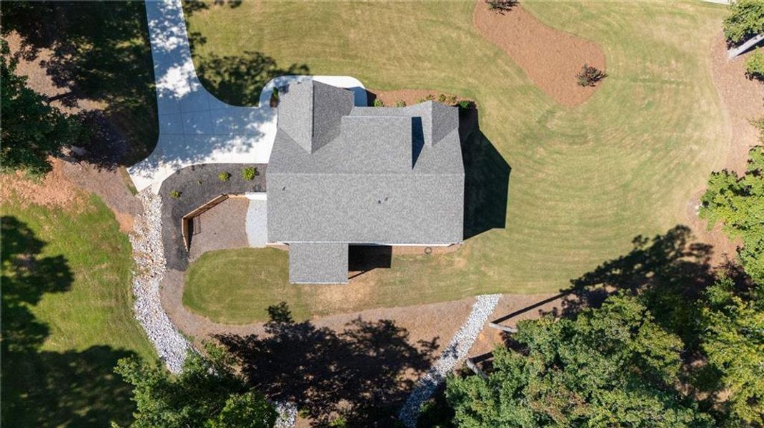 Front exterior of a new home in , Hoschton, GA, highlighting curb appeal (Image 33).