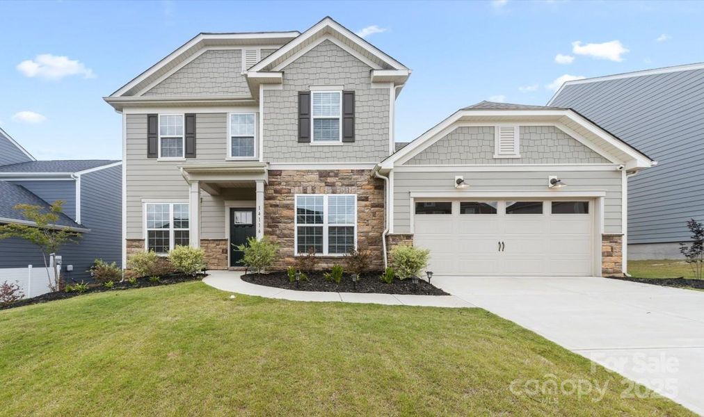 Front exterior of a new home in , Charlotte, NC, highlighting curb appeal (Image 1).