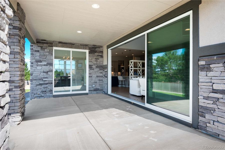 Backyard Covered Patio with Sliding Doors for indoor outdoor living.