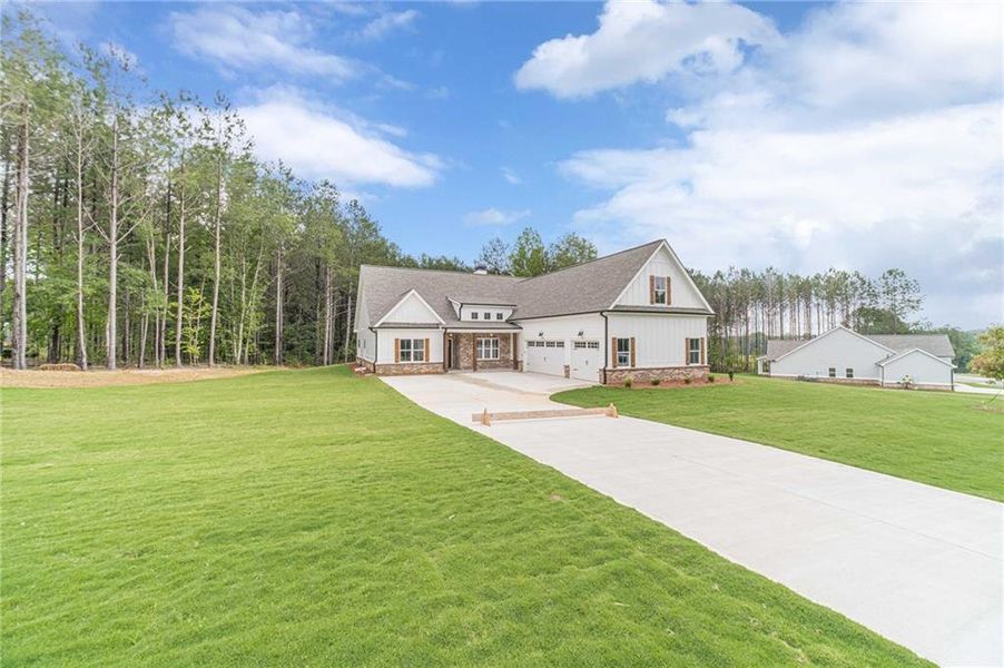 Front exterior of a new home in , Covington, GA, highlighting curb appeal (Image 18).