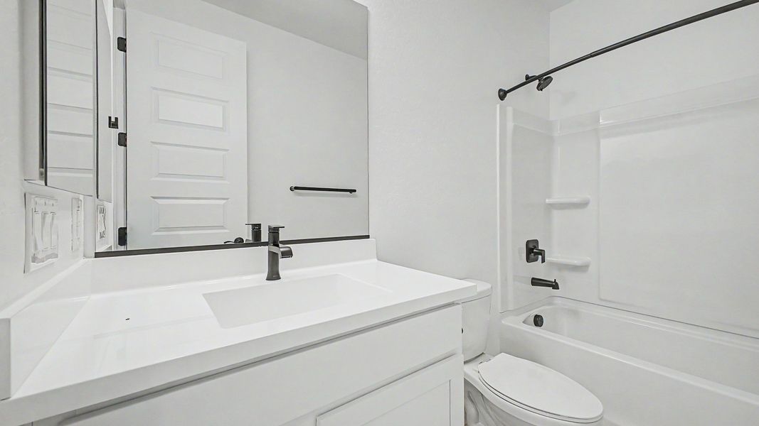 Representative furnished interior of a home built from the Acacia II by DRB Homes in Apache Farms, Buckeye (Image 23).