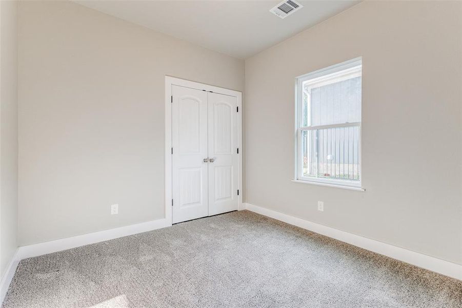 View of carpeted spare room