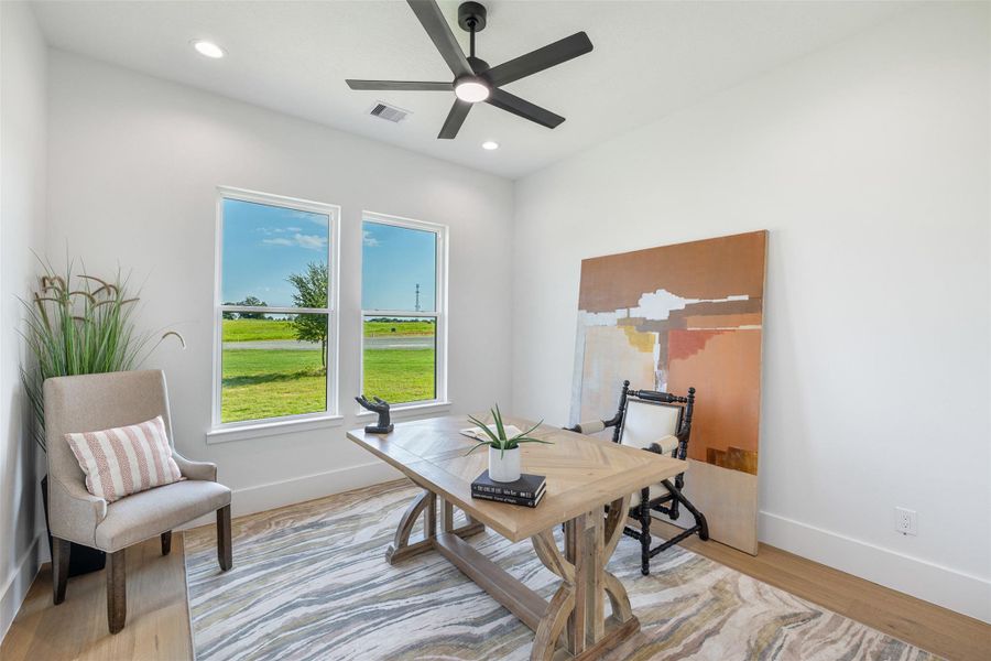 Home office with light wood-style floors, recessed lighting, and a ceiling fan