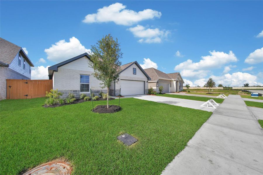 Front exterior of a new home in , Rosharon, TX, highlighting curb appeal (Image 16). Front exterior of a new home in , Rosharon, TX, highlighting curb appeal (Image 16).