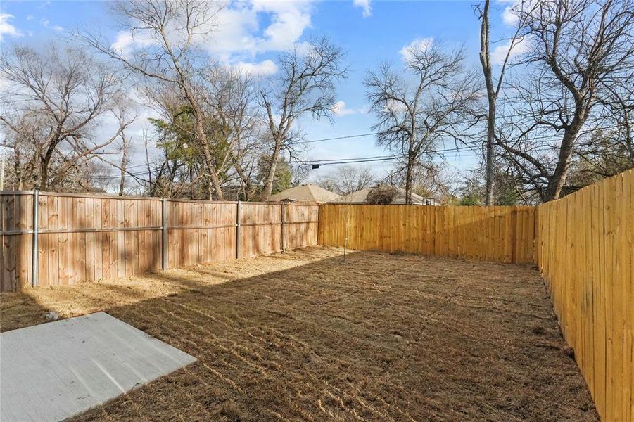 View of fenced backyard