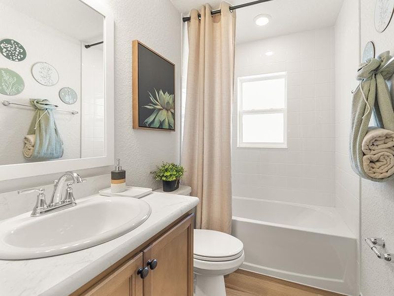 Secondary bedrooms share a convenient hall bath - Raychelby Highland Homes