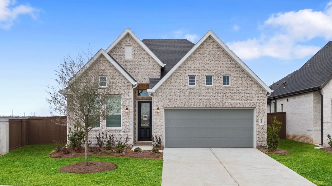 Front exterior of a new home in Brookewater, Rosenberg, TX, highlighting curb appeal (Image 14). Front exterior of a new home in Brookewater, Rosenberg, TX, highlighting curb appeal (Image 14).