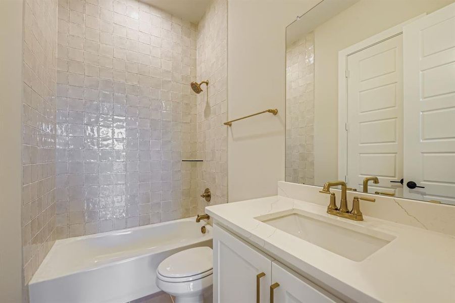 Bathroom featuring washtub / shower combination and vanity