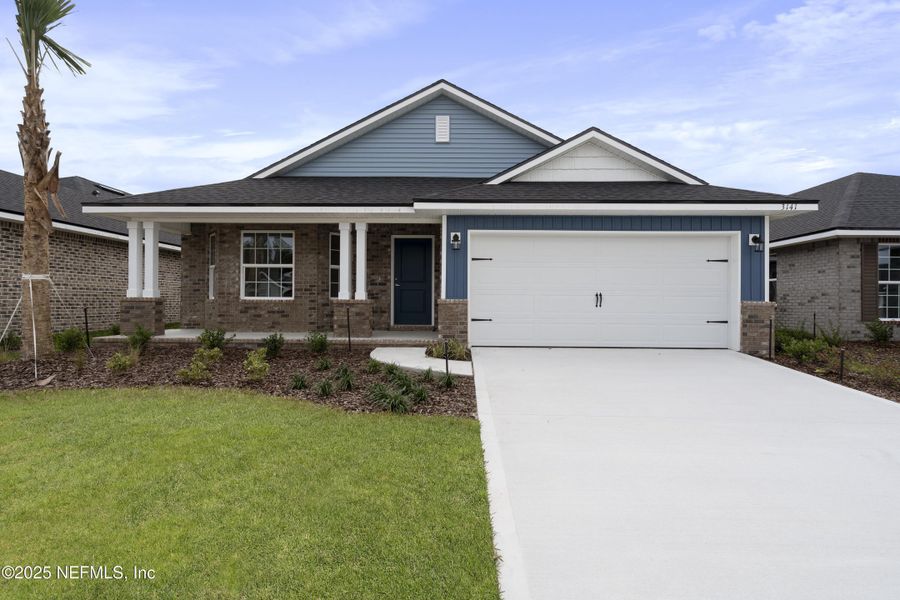 Front exterior of a new home in Shadow Crest at Rolling Hills, Green Cove Springs, FL, highlighting curb appeal (Image 1). Front exterior of a new home in Shadow Crest at Rolling Hills, Green Cove Springs, FL, highlighting curb appeal (Image 1).
