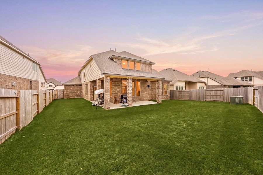 Exterior details and patio area of a home in Sunterra 60ft, Katy (Image 22).