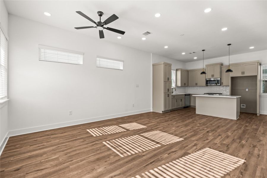 Infinite design possibilities. This sprawling multi-zone space easily accommodates a large dining table and a massive living room layout.