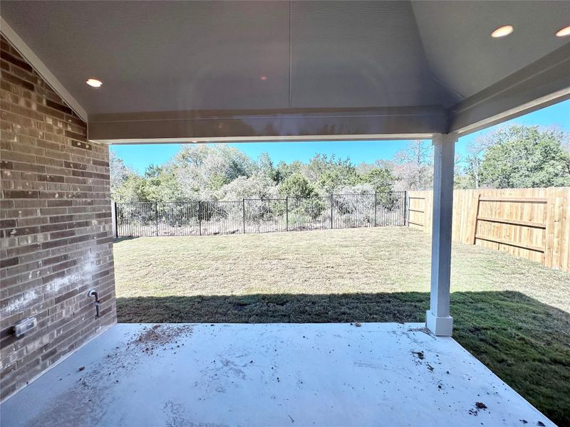 Fenced backyard with a patio Fenced backyard with a patio