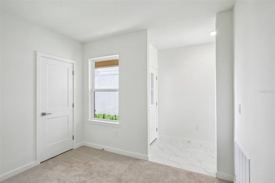 Spacious, unfurnished interior of a new home in Grasslands West, Lakeland (Image 17).