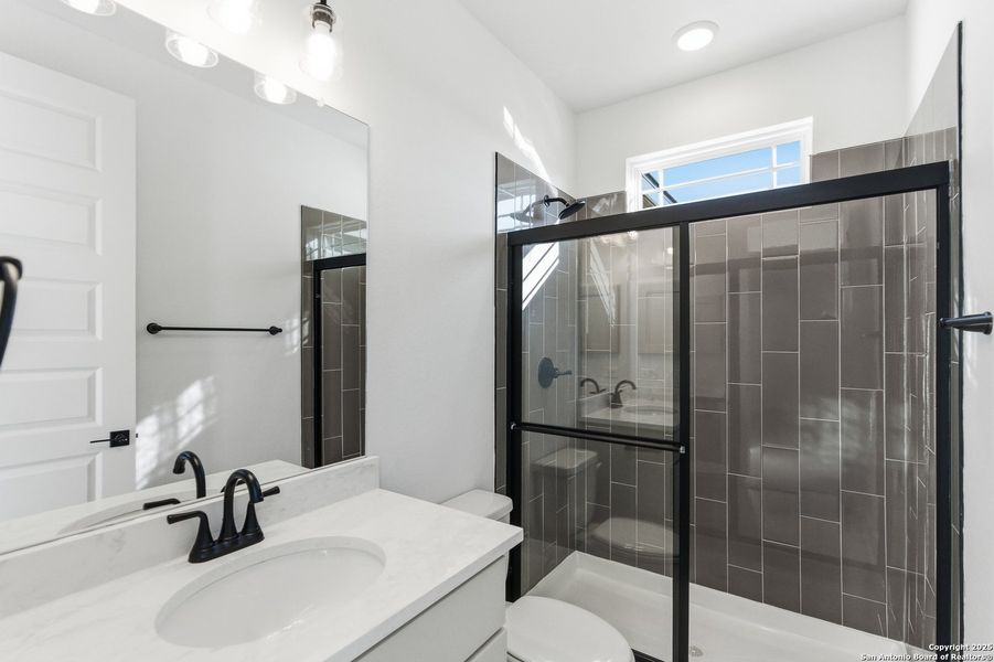 Furnished interior view inside a new home in Caliza Reserve, Boerne (Image 11).