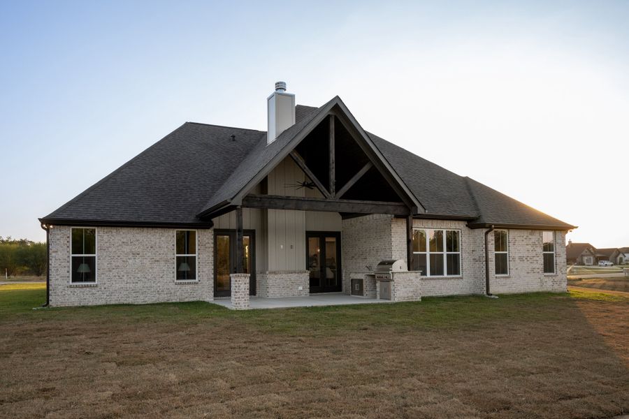 Exterior details and patio area of a home in Windmill Hill, Bryan (Image 36).