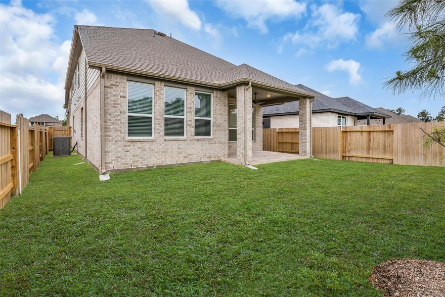 Exterior details and patio area of a home in Evergreen, Conroe (Image 26).