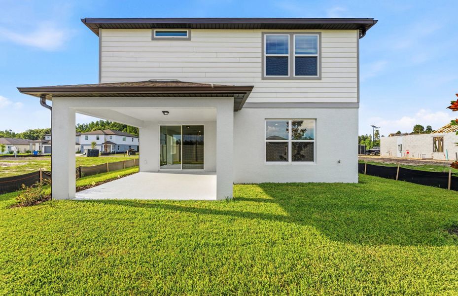 Exterior details and patio area of a home in Riverwood, Zephyrhills (Image 3).