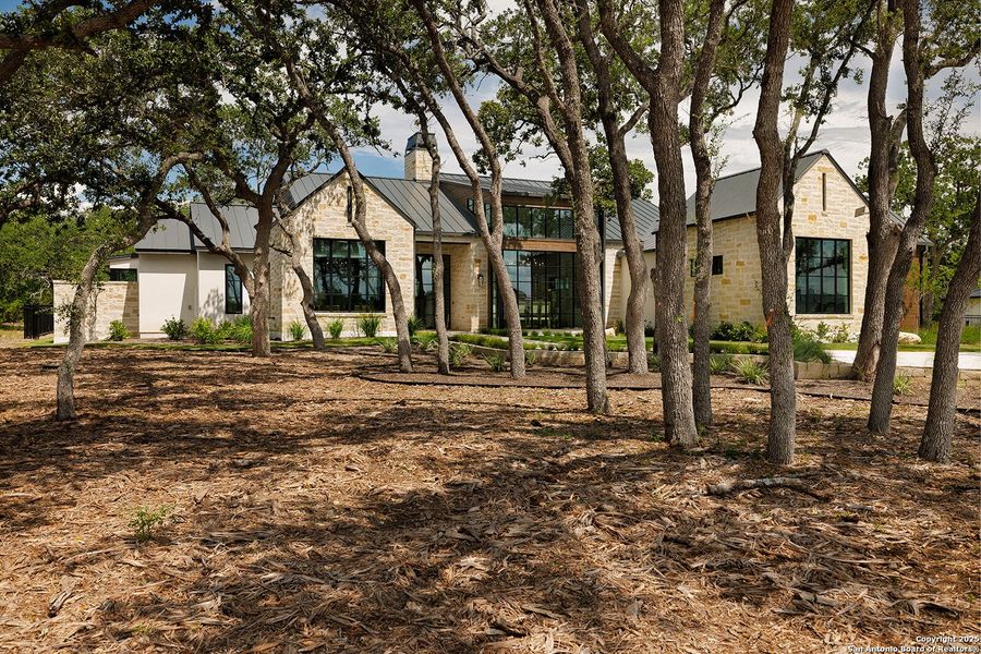 Front exterior of a new home in , Boerne, TX, highlighting curb appeal (Image 20).
