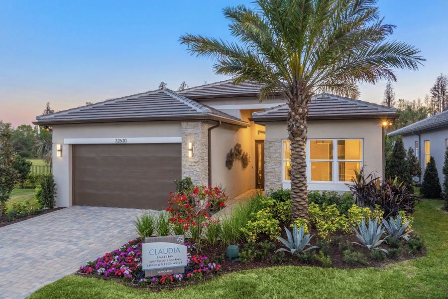 Representative exterior photo of a completed home built from the Claudia by GL Homes in Valencia Ridge, Wesley Chapel, FL (Image 19). Representative exterior photo of a completed home built from the Claudia by GL Homes in Valencia Ridge, Wesley Chapel, FL (Image 19).