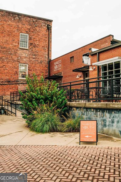 Front exterior of a new home in Rosewood Lake Estates, Hoschton, GA, highlighting curb appeal (Image 22).