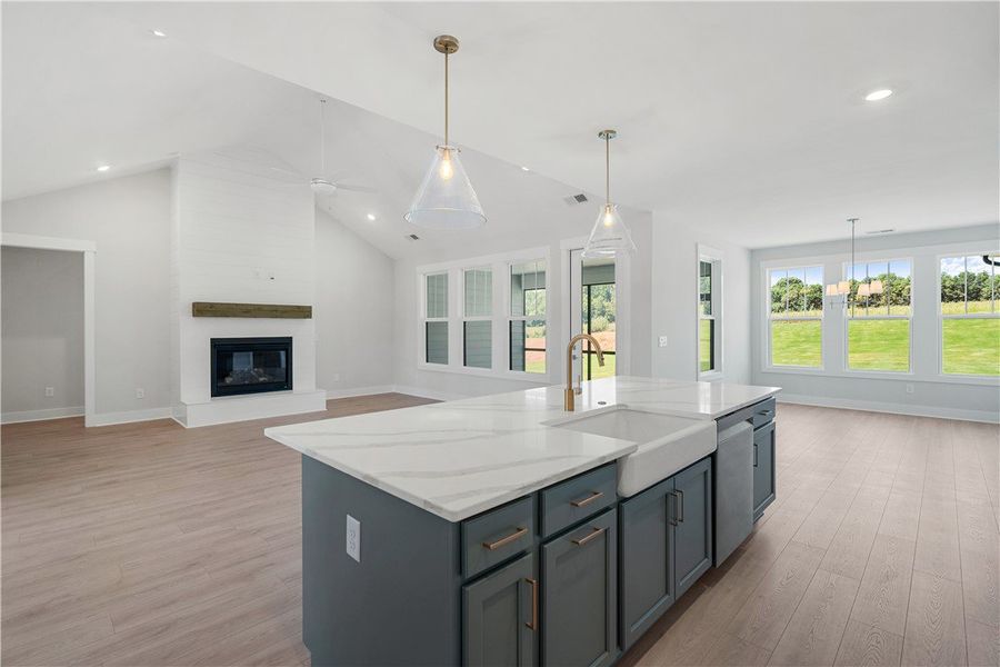 A grand living space featuring vaulted ceilings, a A grand living space featuring vaulted ceilings, a