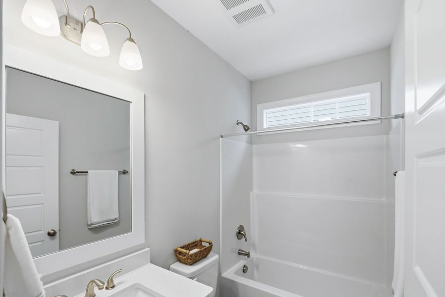 Representative furnished interior of a home built from the Kauai by Bill Clark Homes in The Sanctuary at Sunset Beach, Sunset Beach (Image 19).
