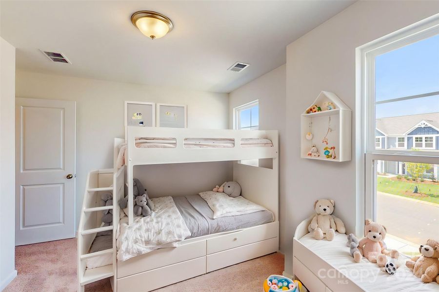 Secondary bedroom shown with virtual staging