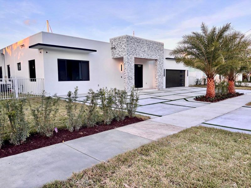 Front exterior of a new home in , Deerfield Beach, FL, highlighting curb appeal (Image 1).
