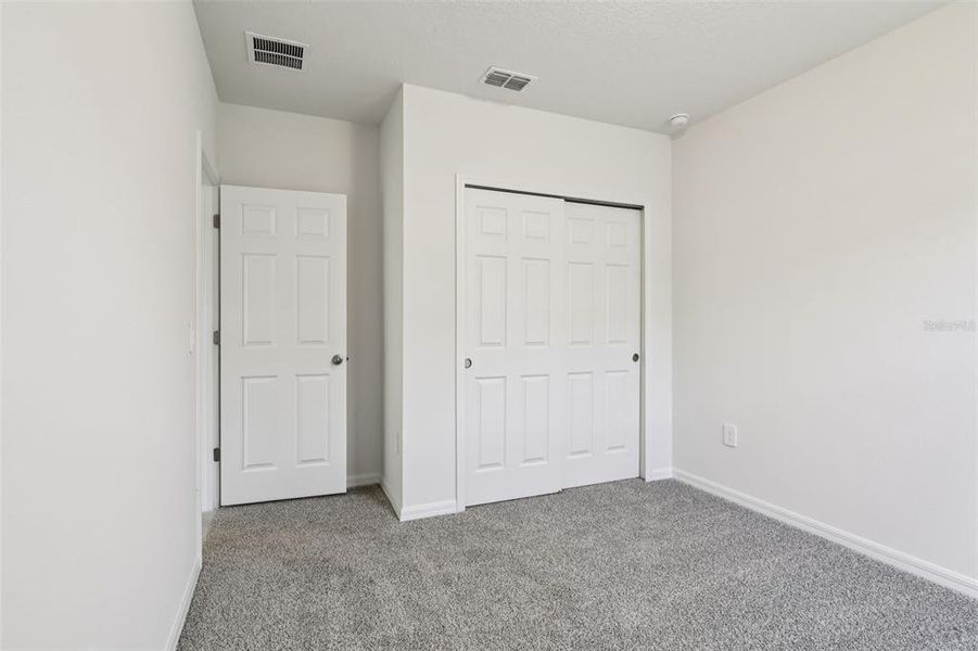 Spacious, unfurnished interior of a new home in Lake Deer Estates - Signature Series, Poinciana (Image 24).