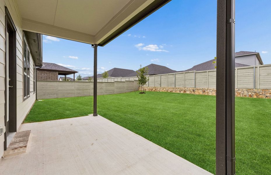Exterior details and patio area of a home in Treeline, Justin (Image 3).
