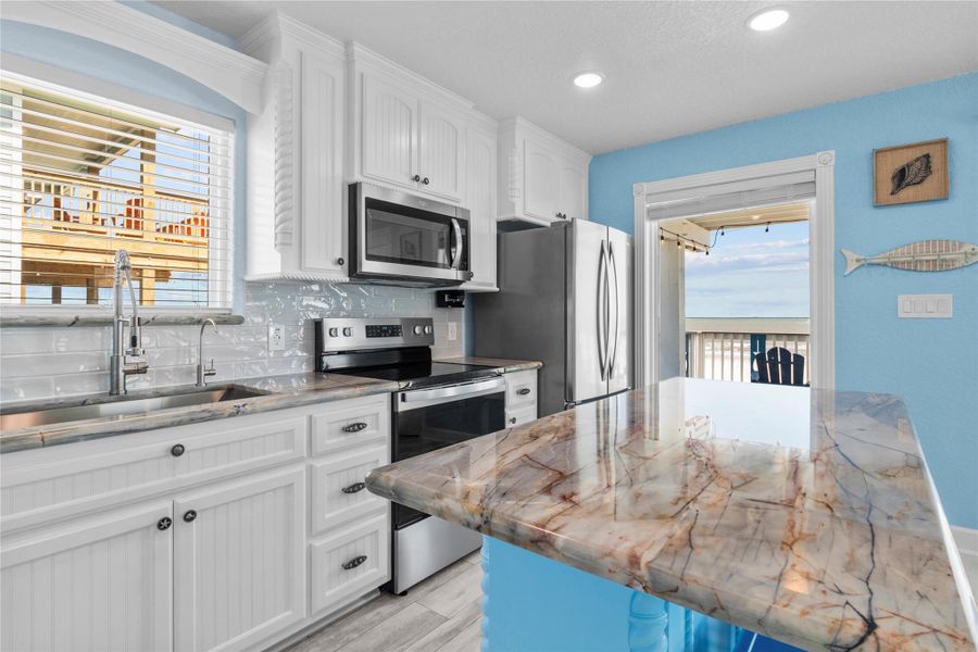 LUXURY Brazilian Quartzite countertop with beautiful veining throughout the kitchen.