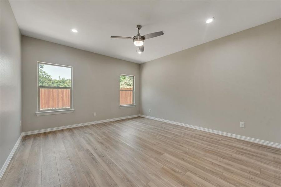 Unfurnished room featuring light hardwood / wood-style floors and ceiling fan