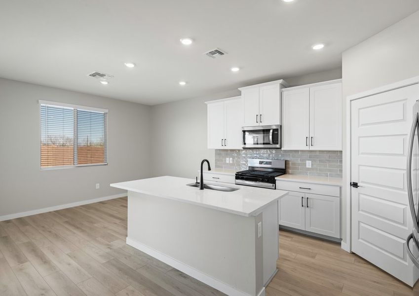 The kitchen overlooks the breakfast nook.