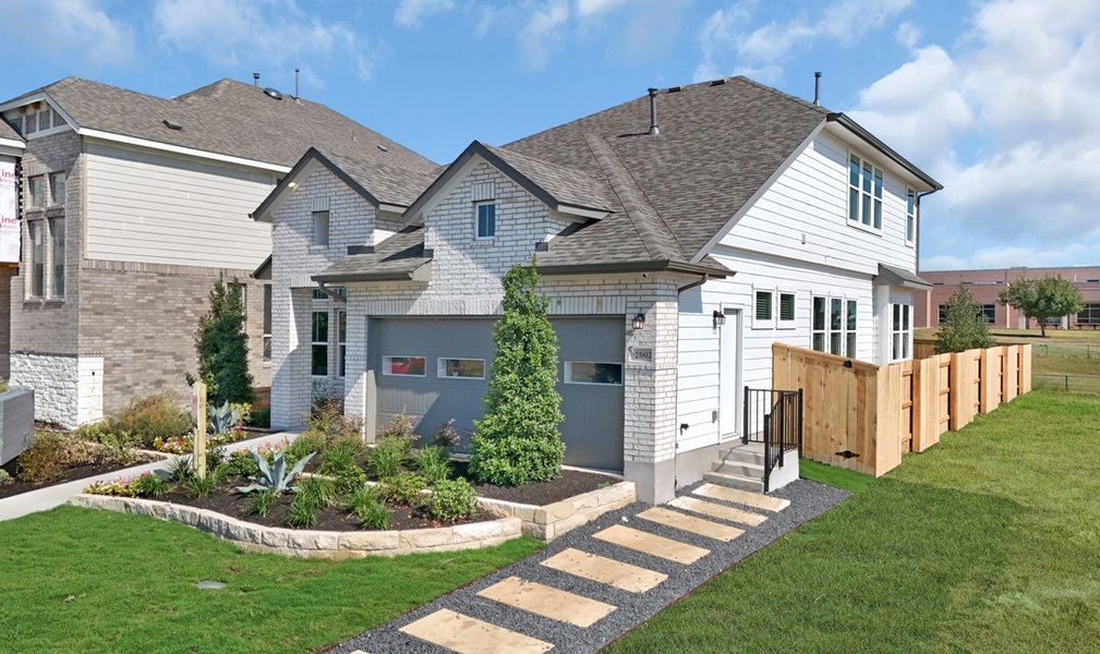 Front exterior of a new home in Briarwood, Elgin, TX, highlighting curb appeal (Image 27).