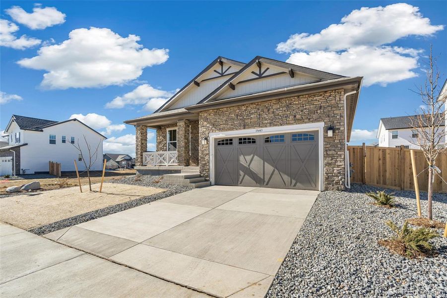 Front exterior of a new home in Windsong, Brighton, CO, highlighting curb appeal (Image 2). Front exterior of a new home in Windsong, Brighton, CO, highlighting curb appeal (Image 2).