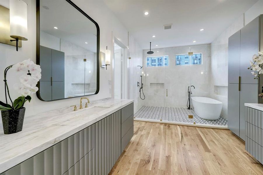 Marble primary bath offering glass enclosed wet room plus dual counters