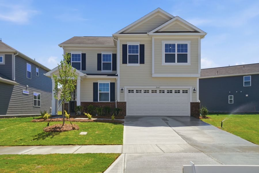 Front exterior of a new home in Waxhaw Landing, Monroe, NC, highlighting curb appeal (Image 1). Front exterior of a new home in Waxhaw Landing, Monroe, NC, highlighting curb appeal (Image 1).