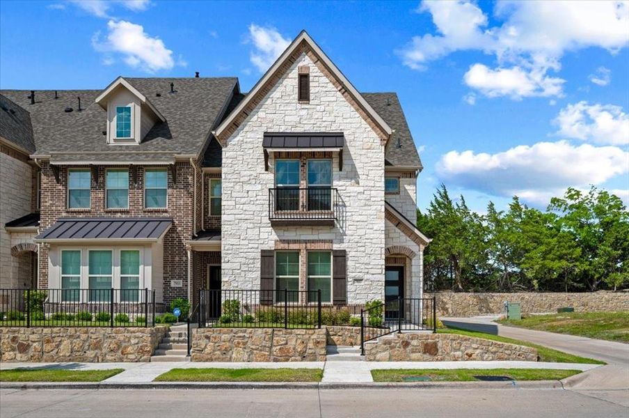 Front exterior of a new home in Bayside, Rowlett, TX, highlighting curb appeal (Image 2). Front exterior of a new home in Bayside, Rowlett, TX, highlighting curb appeal (Image 2).