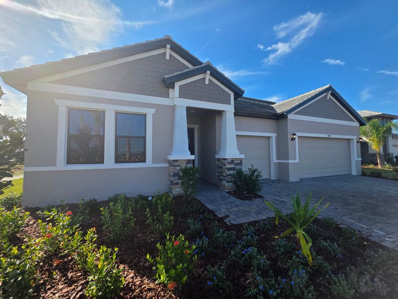 Front exterior of a new home in River Preserve Estates, Parrish, FL, highlighting curb appeal (Image 2). Front exterior of a new home in River Preserve Estates, Parrish, FL, highlighting curb appeal (Image 2).