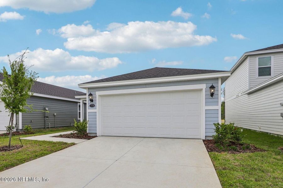 Front exterior of a new home in Kings Preserve, Jacksonville, FL, highlighting curb appeal (Image 22).