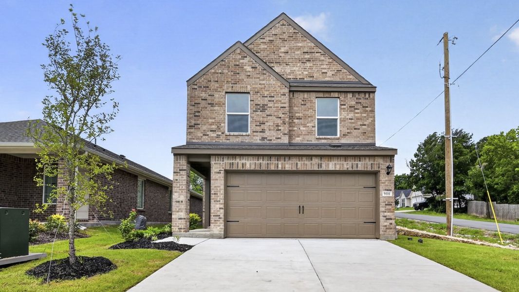 Front exterior of a new home in Hanolley Hills, Sherman, TX, highlighting curb appeal (Image 1). Front exterior of a new home in Hanolley Hills, Sherman, TX, highlighting curb appeal (Image 1).