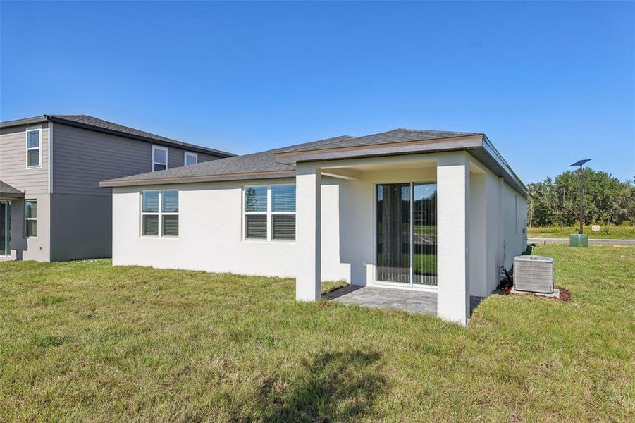 Exterior details and patio area of a home in The Reserve at Hammock Oaks - Signature Series, Lady Lake (Image 20).