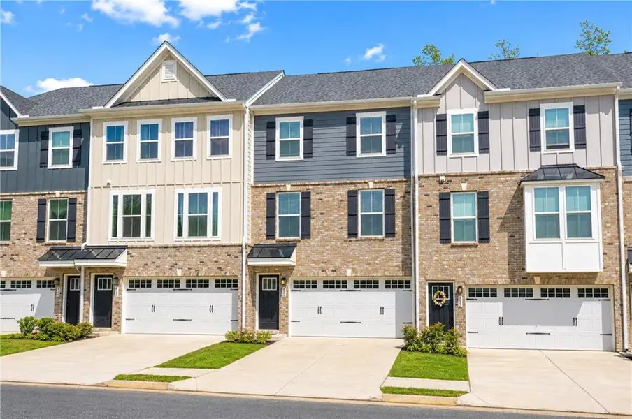 Front exterior of a new home in , Sugar Hill, GA, highlighting curb appeal (Image 2). Front exterior of a new home in , Sugar Hill, GA, highlighting curb appeal (Image 2).