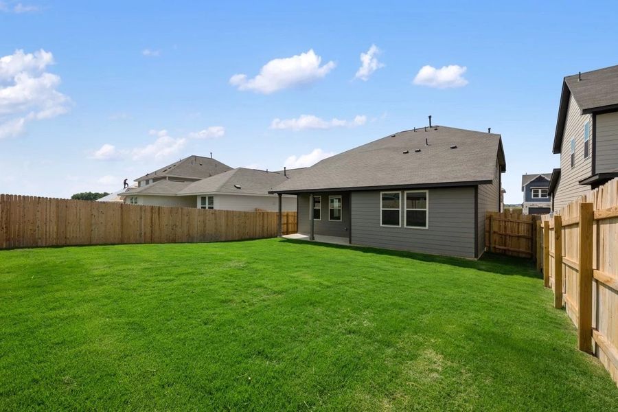 Exterior details and patio area of a home in Rolling Glen, Hutto (Image 4).