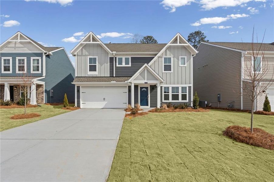 Front exterior of a new home in Twin Lakes, Hoschton, GA, highlighting curb appeal (Image 19).