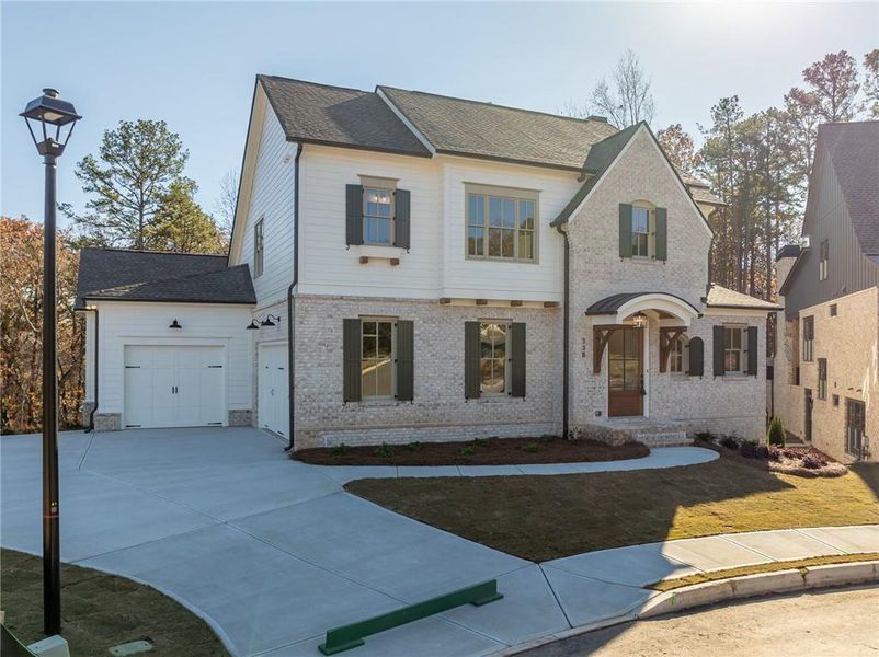 Front exterior of a new home in , Ball Ground, GA, highlighting curb appeal (Image 1).