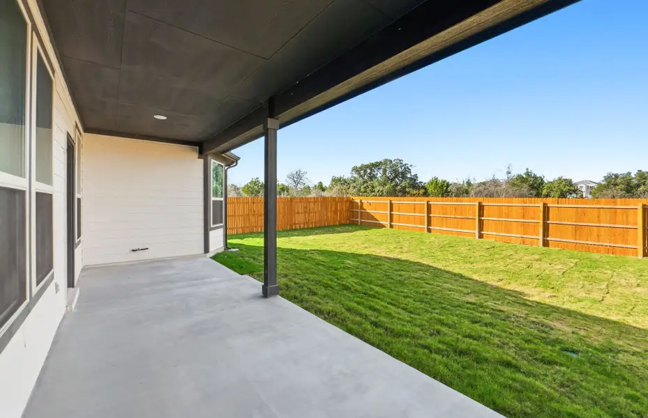 Exterior details and patio area of a home in Saddleback at Santa Rita Ranch, Liberty Hill (Image 4).